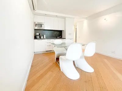 a living room with a couch and a table at Tony Allard By Winsome Destination 3E in Cannes