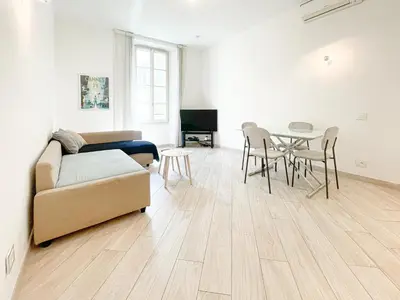a living room with a couch and a table and chairs at Tony Allard By Winsome Destination 2E in Cannes