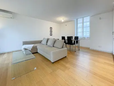 a living room with a couch and a table at Tony Allard By Winsome Destination 3D in Cannes