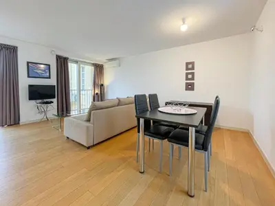 a living room with a table and chairs and a couch at Tony Allard By Winsome Destination 3D in Cannes