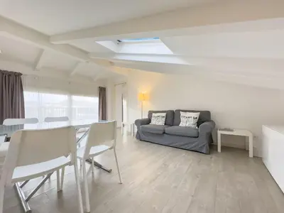 a living room with a couch and a table at Tony Allard By Winsome Destination 4B in Cannes