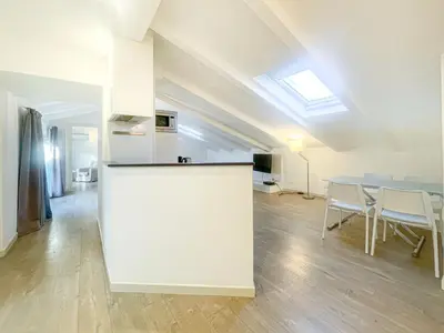 a kitchen and dining room with a table and chairs at Tony Allard By Winsome Destination 4B in Cannes