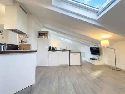 a kitchen with white cabinets and a sink at Tony Allard By Winsome Destination 4B in Cannes