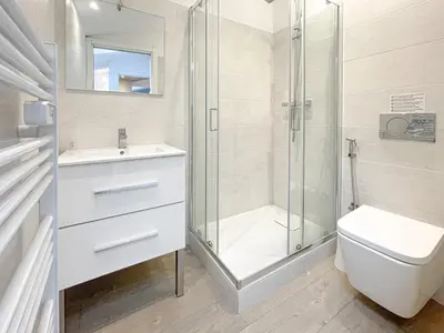 a bathroom with a shower and a toilet and a sink at Tony Allard By Winsome Destination 4A in Cannes