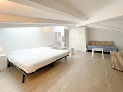 a bedroom with a large bed and a couch at Tony Allard By Winsome Destination 4A in Cannes
