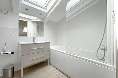 a bathroom with a white tub and a sink at Tony Allard By Winsome Destination 4A in Cannes