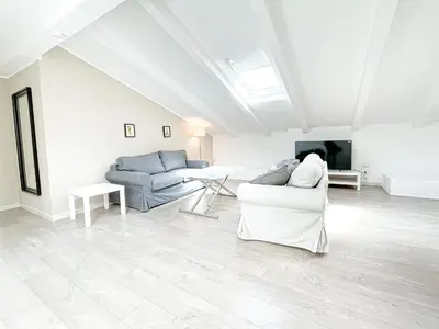 a living room with two couches and a table at Tony Allard By Winsome Destination 4C in Cannes