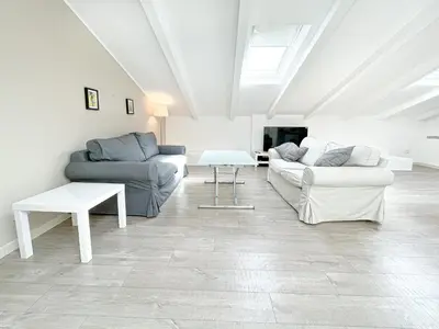a living room with two couches and a bed at Tony Allard By Winsome Destination 4C in Cannes