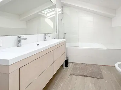 a white bedroom with a large bed with white sheets at Tony Allard By Winsome Destination 4C in Cannes