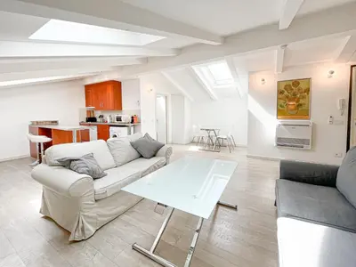 a living room with a couch and a table at Tony Allard By Winsome Destination 4C in Cannes