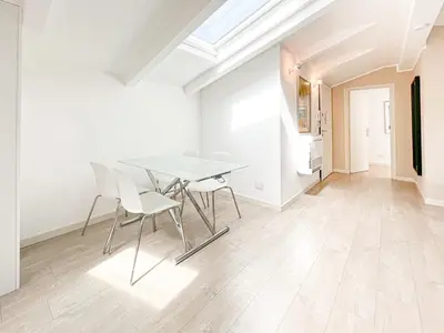 a bedroom with a bed in a white room at Tony Allard By Winsome Destination 4C in Cannes