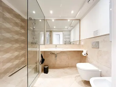 a bathroom with a shower and a toilet and a sink at Tony Allard By Winsome Destination 3F in Cannes