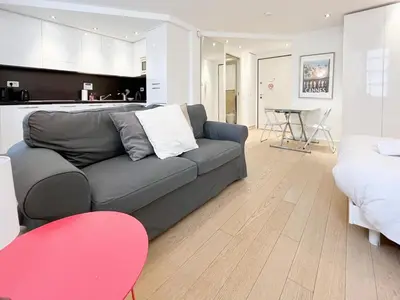 a living room with a couch and a kitchen at Tony Allard By Winsome Destination 3F in Cannes