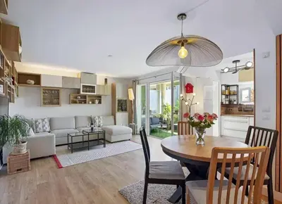a living room with a table and a dining room at Appartement T3 Cannes centre in Cannes
