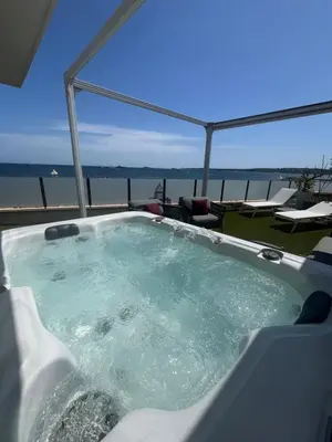 a jacuzzi tub with a view of the ocean at Villa Marsa - Cannes - on beach in Cannes