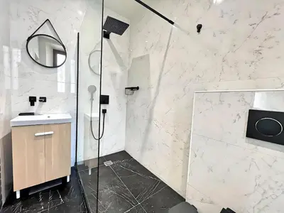 a bathroom with a shower and a sink at Villa Marsa - Cannes - on beach in Cannes