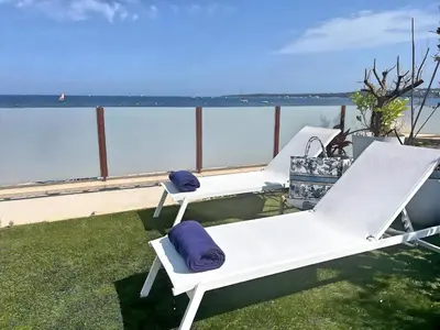 two white beds on a balcony with the ocean at Villa Marsa - Cannes - on beach in Cannes