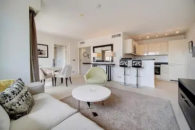 a living room with a couch and a table at Carlton Riviera Cannes - Dernier étage - Palme d'Or in Cannes