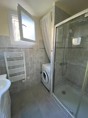 a bathroom with a shower and a toilet and a sink at 3 Pièces avec grande terrasse in Cannes