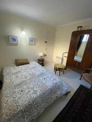a bedroom with a bed and a large mirror at 3 Pièces avec grande terrasse in Cannes
