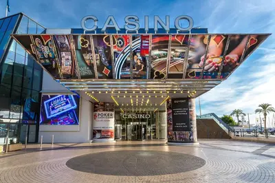 a building with a sign that reads casino at APRT Cannes Beach Festival ARNESE in Cannes