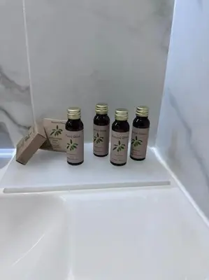 four bottles of jam sitting in a white drawer at Superbe Studio avec balcon Rue d’Antibes in Cannes