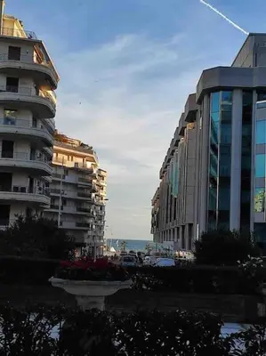 a view of a city with buildings and the ocean at Superbe Studio avec balcon Rue d’Antibes in Cannes