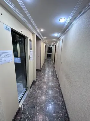 a hallway in a building with a hallwayngth at Superbe Studio avec balcon Rue d’Antibes in Cannes