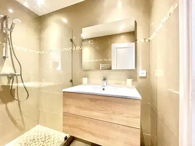 a bathroom with a sink and a shower at Colony 2 in Cannes