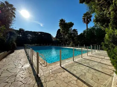a swimming pool with a fence around it at A013-Apt vue mer avec piscine et terrasse in Cannes