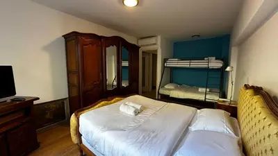 a bedroom with a bed and a bunk bed at A069-Apt in residence with pool and sea view - Cannes in Cannes