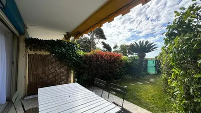 a white picnic table sitting on a patio at A050-Studio avec jardin prive Cannes pres de la plage in Cannes