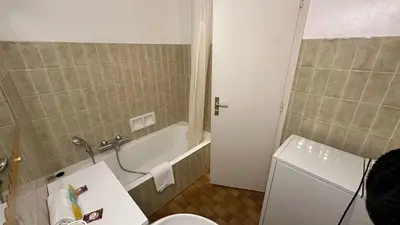 a bathroom with a tub and a toilet and a sink at A050-Studio avec jardin prive Cannes pres de la plage in Cannes