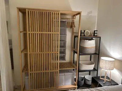 a room with a closet with a book shelf at A050-Studio avec jardin prive Cannes pres de la plage in Cannes