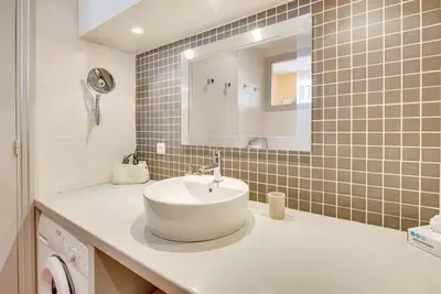 a bathroom with a sink and a mirror at A084-Welcoming apartment in Rue d'Antibes the heart of Cannes in Cannes