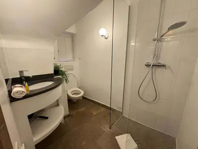 a bathroom with a shower and a sink and a toilet at B005-Charmant appartement au coeur du Suquet in Cannes