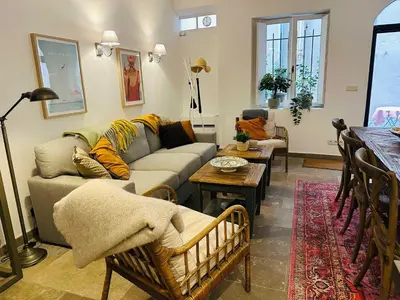 a living room with a couch and a table at B005-Charmant appartement au coeur du Suquet in Cannes