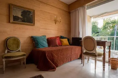 a bedroom with a bed and two chairs and a table at A081-Cannes Appartement avec terrasse au calme in Cannes