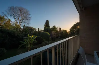 a balcony of a house with a fence and trees at A081-Cannes Appartement avec terrasse au calme in Cannes