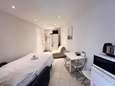 a small room with a bed and a small table at A043-Functional Studio Downtown Cannes in Cannes