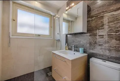 a bathroom with a sink and a toilet and a window at B045-Studio croisette AC close Congress center SEA in Cannes