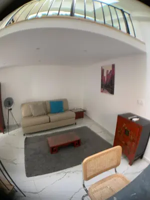 a living room with a couch and a table at STA5 Cannes, le suquet in Cannes