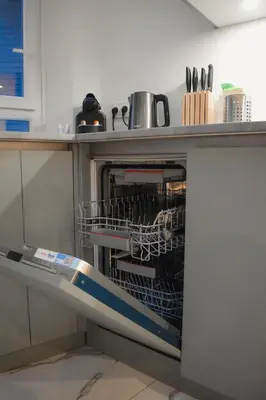 a dishwasher with dishes in it in a kitchen at STA5 Cannes, le suquet in Cannes
