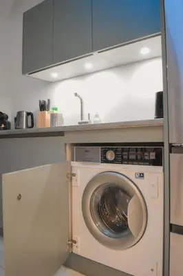 a kitchen with a washing machine under a counter at STA5 Cannes, le suquet in Cannes