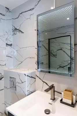 a bathroom with a sink and a mirror at Le Louis Blanc - Hypercentre - 100m Suquet - AC in Cannes