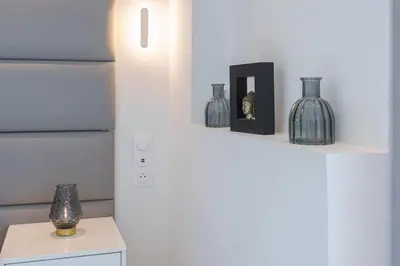 a shelf with glass vases and a box on it at Le Louis Blanc - Hypercentre - 100m Suquet - AC in Cannes