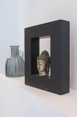 a small black block with a head on a shelf at Le Louis Blanc - Hypercentre - 100m Suquet - AC in Cannes