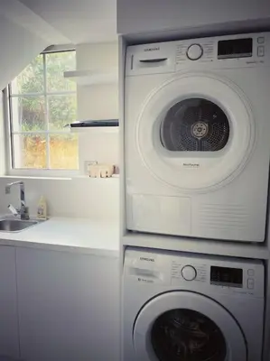 a washing machine in a kitchen next to a sink at Villa Lion, gorgeous villa in Le Cannet overlooking Cannes in Le Cannet