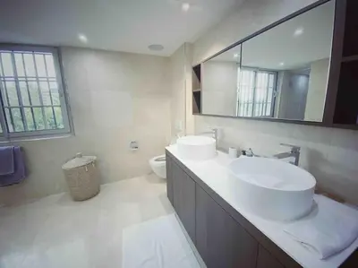 a bathroom with a sink and a mirror and a toilet at Villa Lion, gorgeous villa in Le Cannet overlooking Cannes in Le Cannet