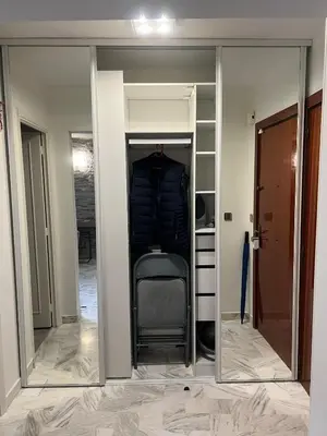a mirror in a closet with a chair in it at Chic 47m2, 2 rooms, ground floor, nice patio, 280m beach Croisette in Cannes